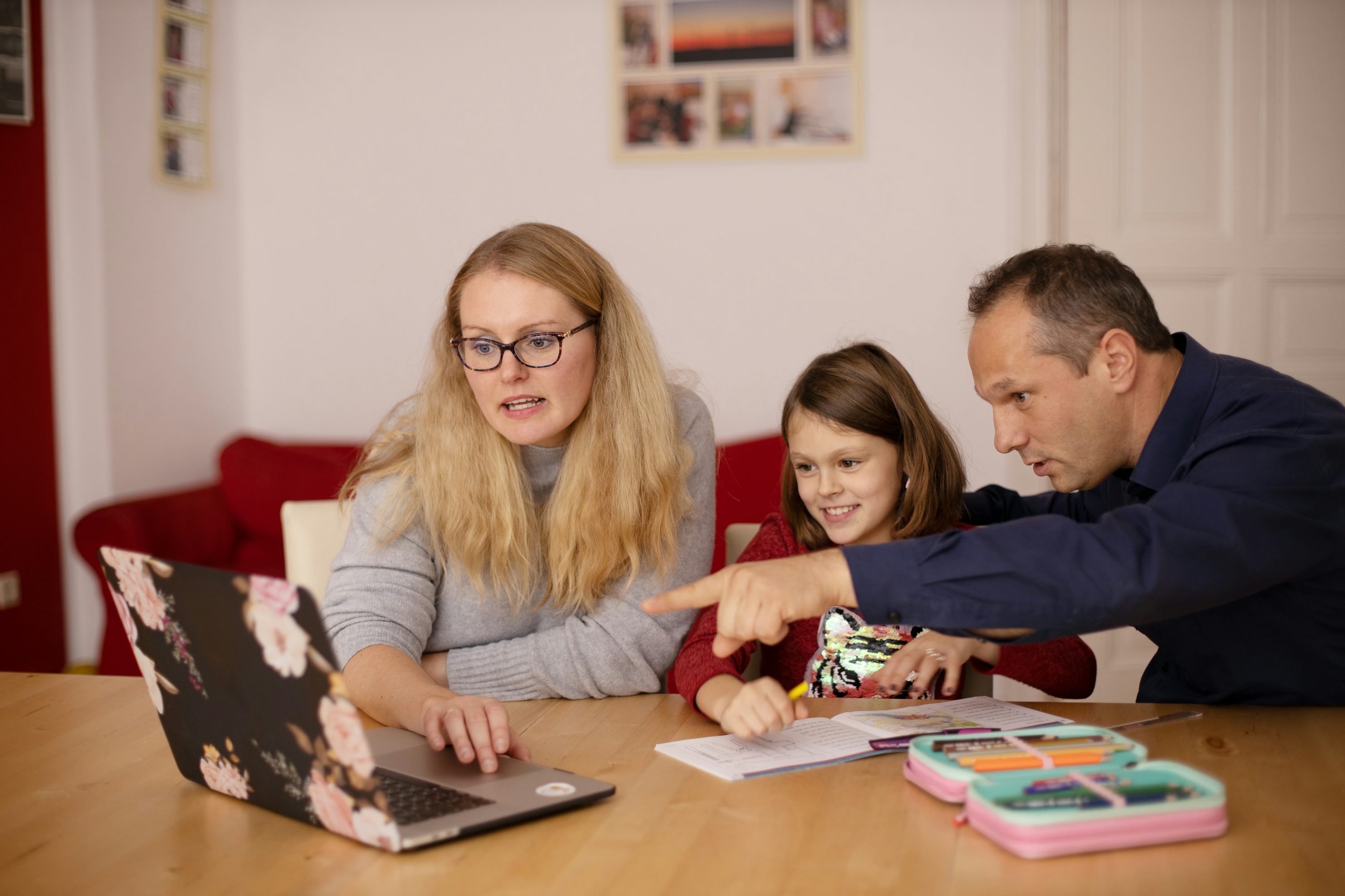 A family calmly reviewing learning activities together at home